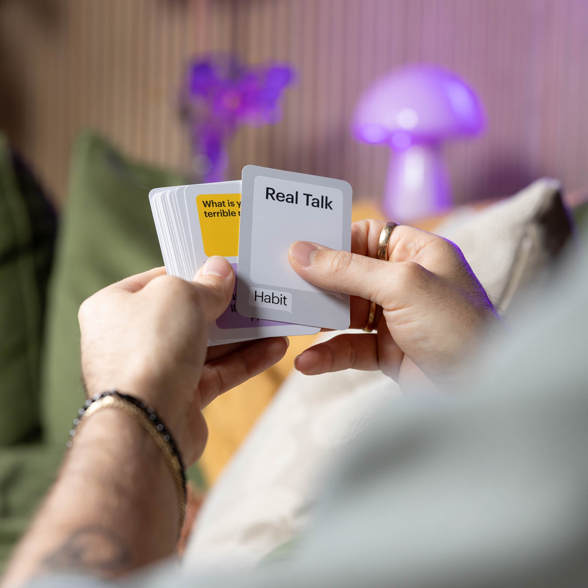 Habit Real Talk, hands holding deep question cards