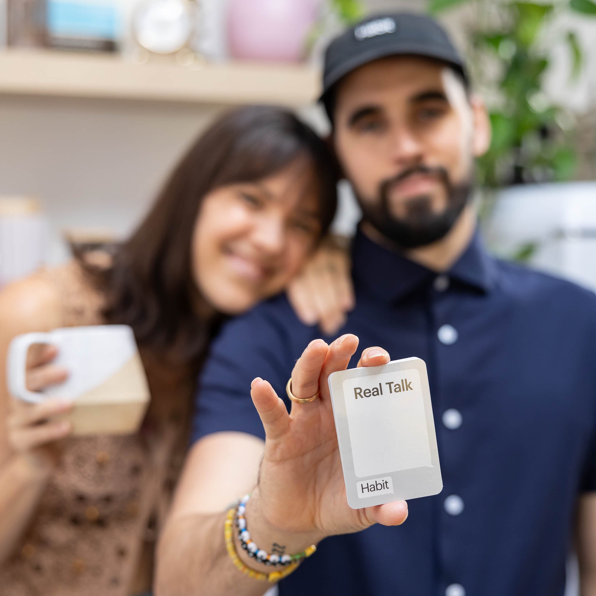 Two humans building connection through conversation card game