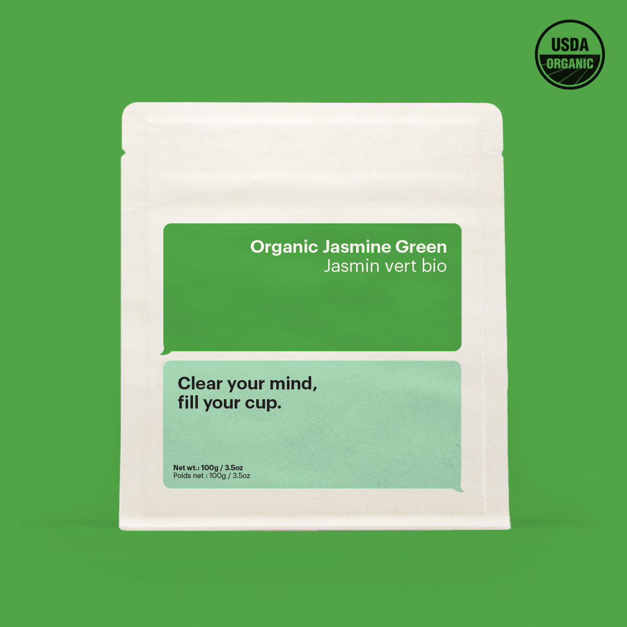 A package of Organic Jasmine Green loose leaf tea with the USDA organic seal, set against a green background with wording on packing to incite deep conversation " clear your mind, fill your cup"