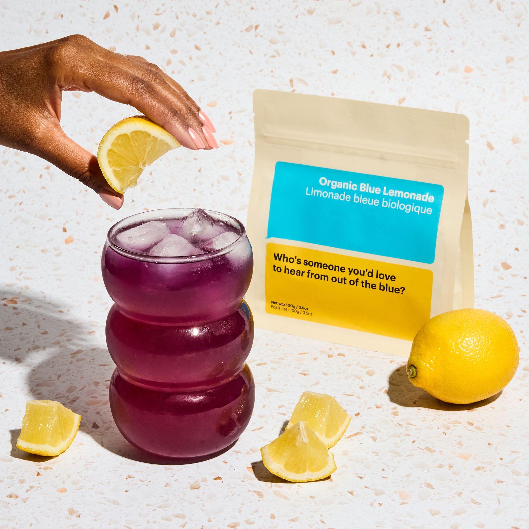 Organic blue lemonade, viral color changing tea, Butterfly Pea Flower Tea, lemon squeezed into iced tea